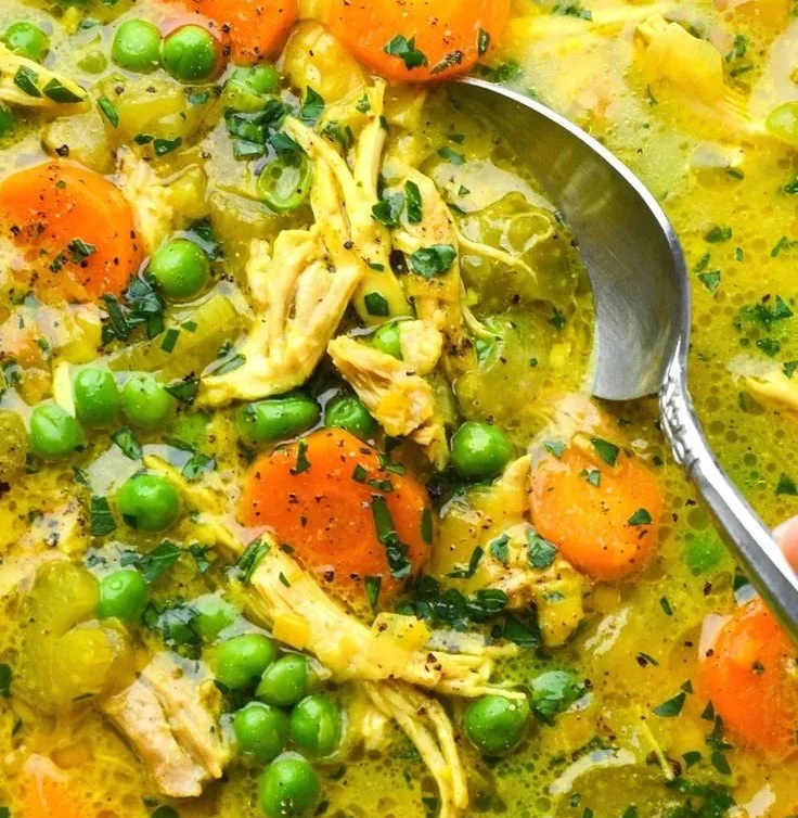 Bowl of anti-inflammatory turmeric chicken soup, Whole30, Paleo, gluten-free