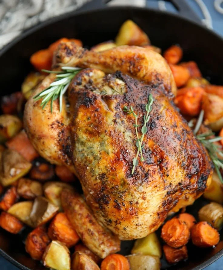 Juicy roasted whole chicken seasoned to perfection and served on a rustic platter.