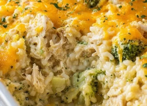 Cheesy broccoli chicken and rice casserole baked in a dish, ready to serve.