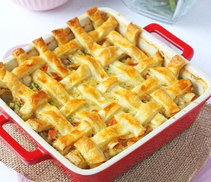 Cheesy Chicken and Sausage Lattice Pie served in a dish