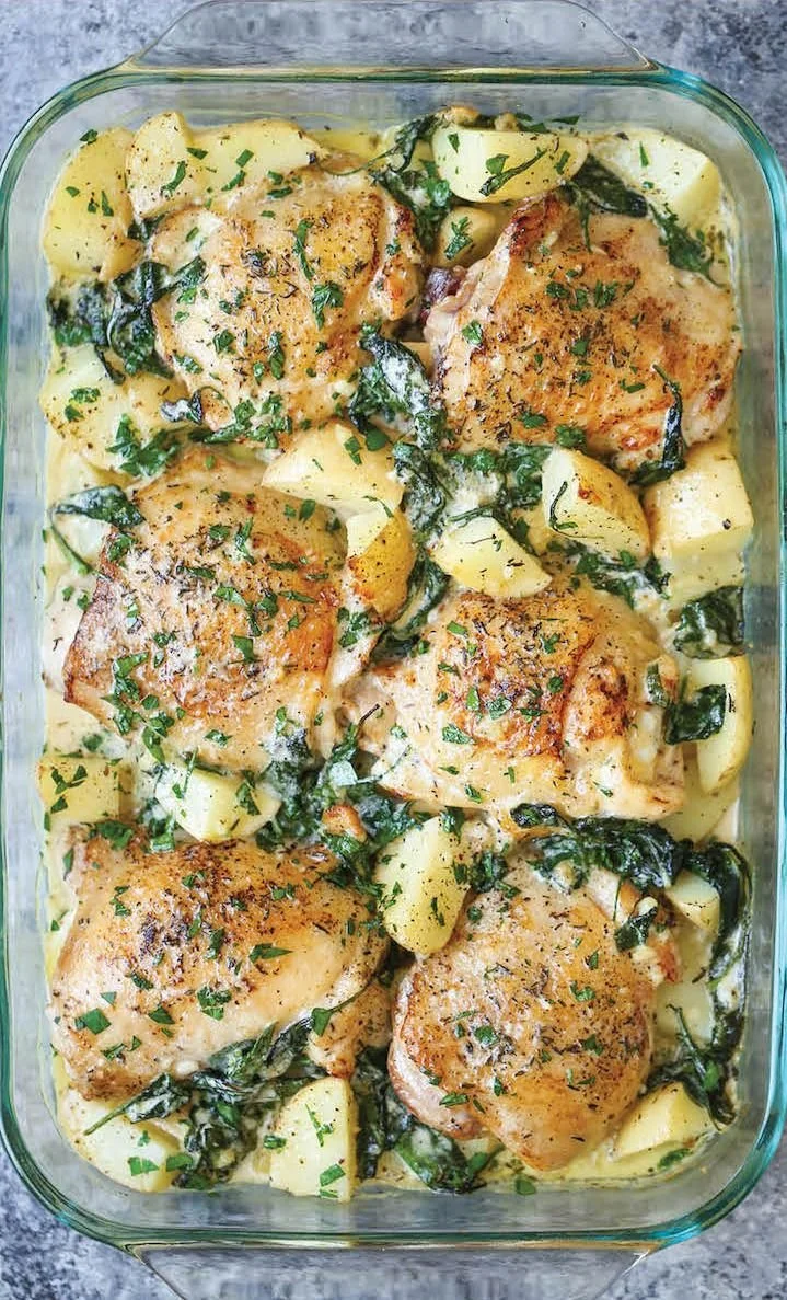 Delicious chicken and potatoes drizzled with garlic parmesan cream sauce