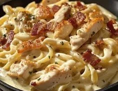 Creamy Chicken Bacon Ranch Pasta dish with vegetables and alfredo sauce