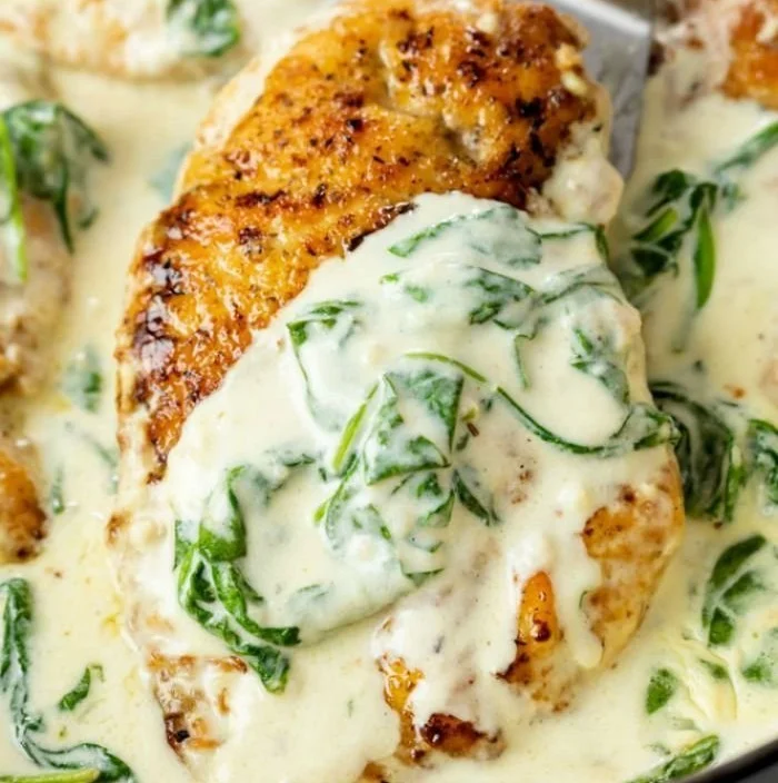 Delicious Chicken Florentine served with spinach and creamy sauce.