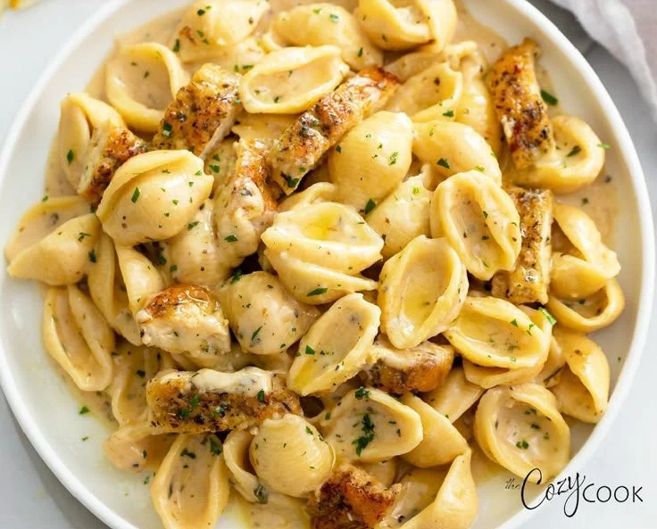 Delicious Chicken Pasta served with fresh herbs and vegetables
