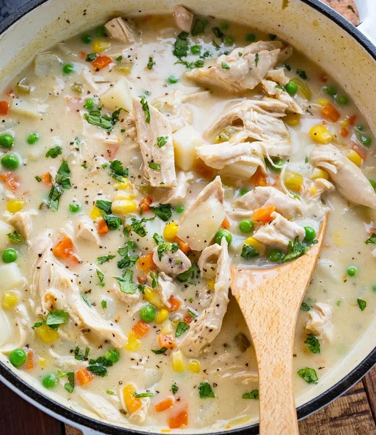 Delicious Chicken Pot Pie Soup served in a bowl with fresh herbs
