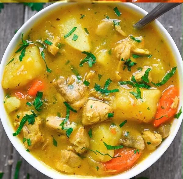 A delicious bowl of homemade chicken stew with vegetables and herbs