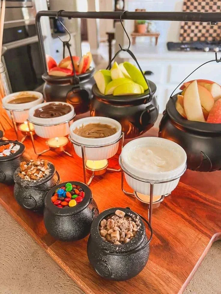 Customized fall caramel apple bar with toppings for Halloween parties