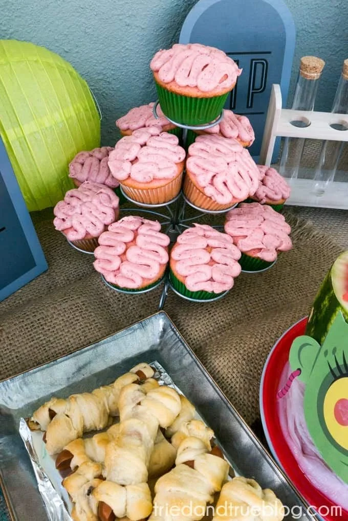 Kids enjoying a cute Halloween zombie party with fun decorations and costumes.