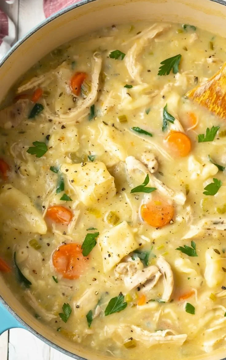 Delicious bowl of easy homemade chicken and dumplings topped with fresh herbs