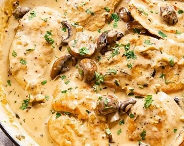 Delicious garlic mushroom chicken dish served with herbs and spices