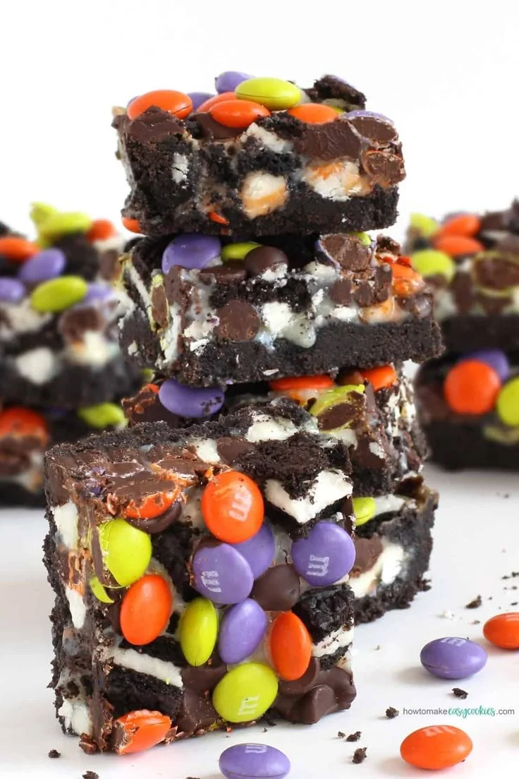 Delicious Halloween magic bars with festive toppings and decorations