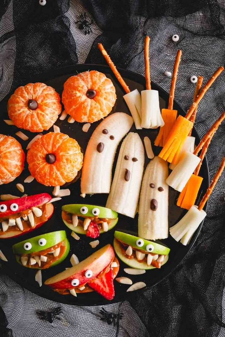 Bowl of healthy Halloween snacks for kids including fruits and veggies
