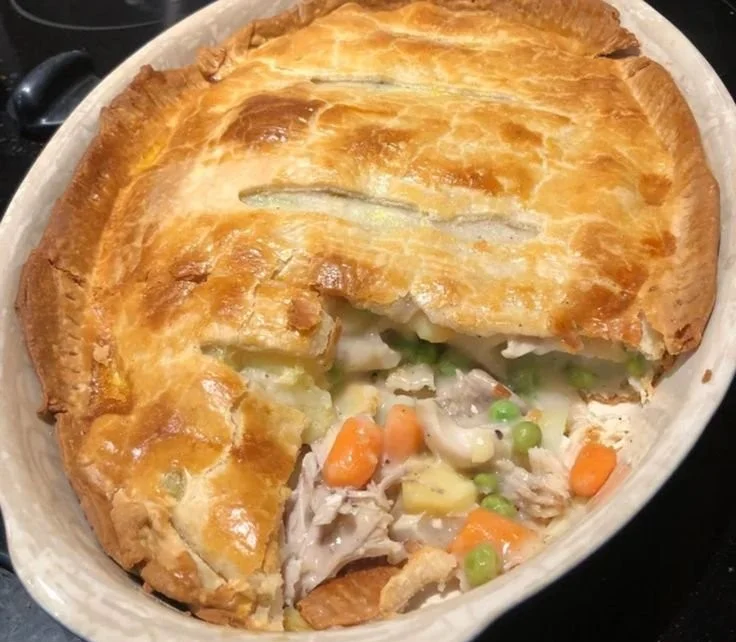 Homemade chicken pot pie with flaky crust and vegetables