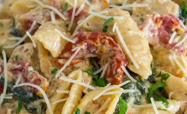 Delicious bowl of Instant Pot Tuscan Chicken Pasta with creamy sauce and herbs