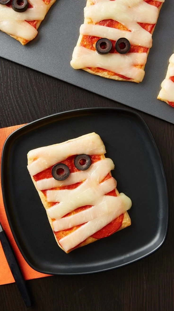 Delicious and fun Crescent Mummy Pizzas made for Halloween