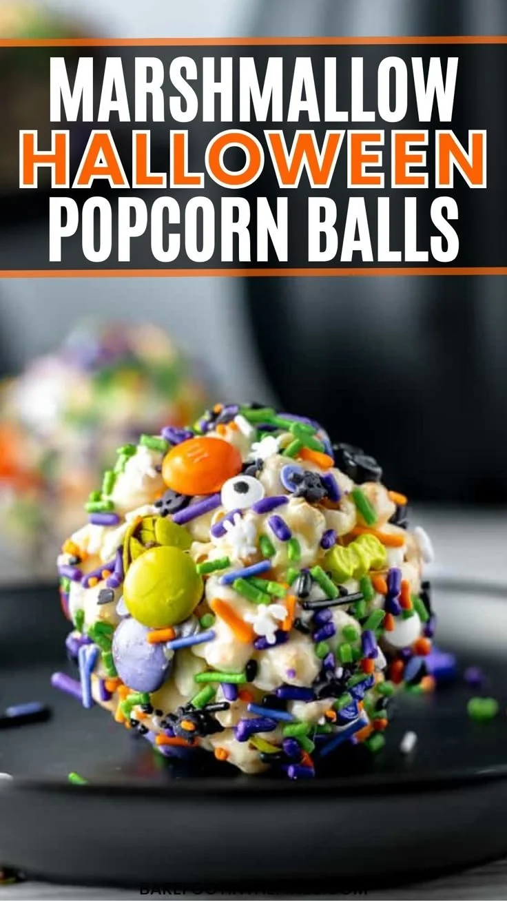 Colorful Halloween popcorn balls made with marshmallows for festive treats.