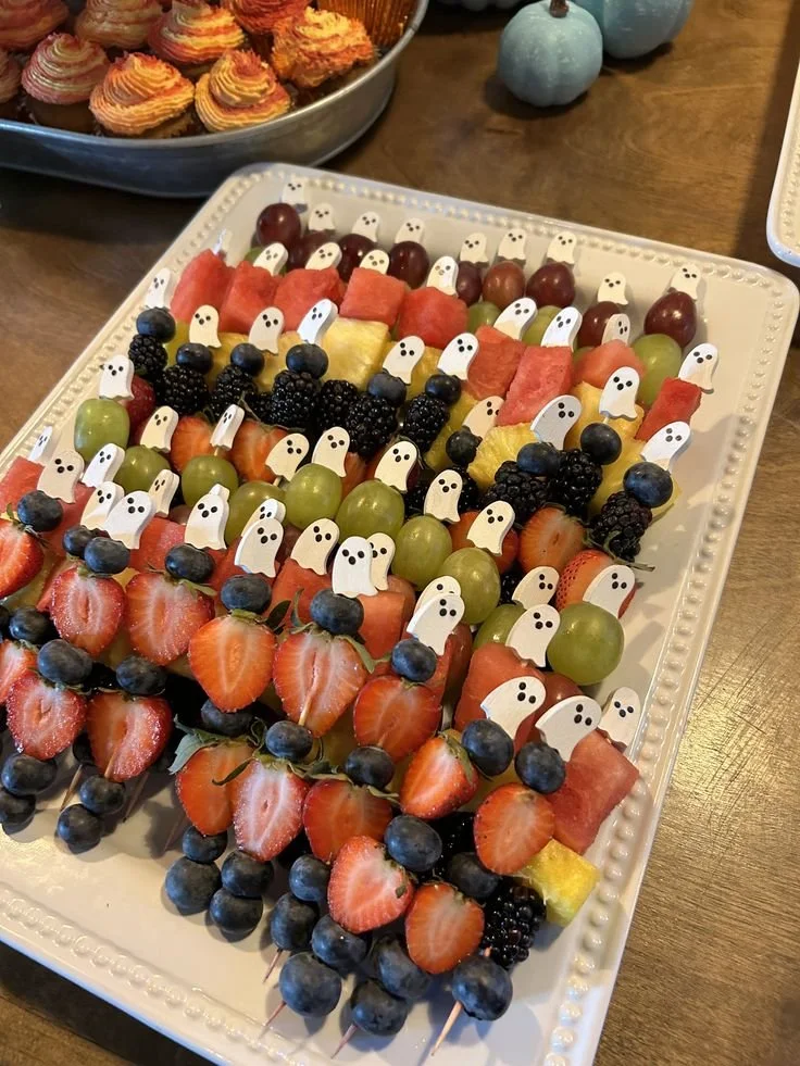 Halloween Baby Shower decorations and treats for a festive celebration