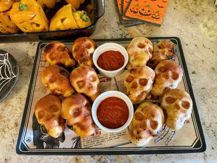 Delicious skull-shaped pizza bombs for Halloween party