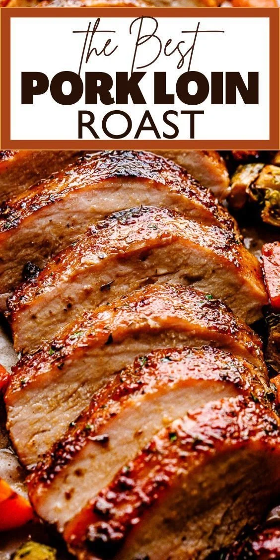 Juicy and tender pork roast dish garnished with herbs and spices.