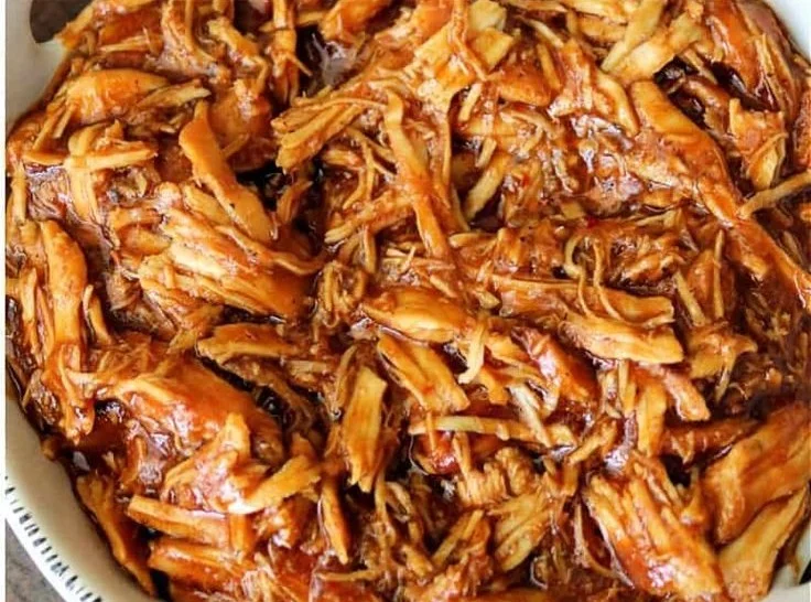 Delicious Crockpot BBQ Chicken served with coleslaw and buns
