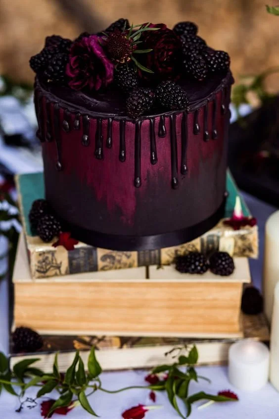 Elegant Halloween wedding cake with spooky decorations and autumn colors