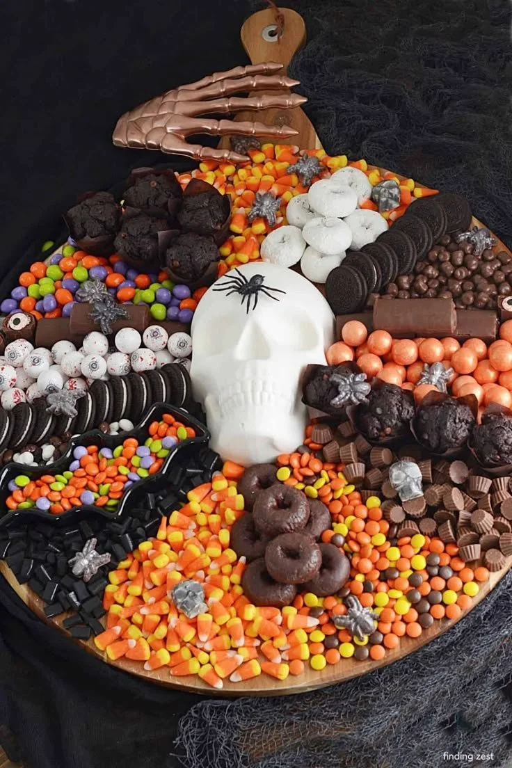 A beautifully arranged dessert charcuterie board featuring various sweets and treats.