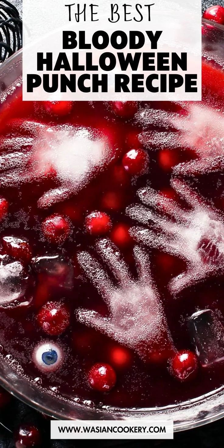 Blood-red Halloween punch in a spooky themed glass for Halloween party