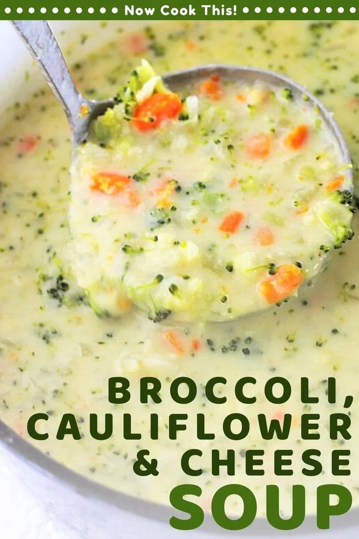 Bowl of creamy broccoli cauliflower cheese soup garnished with herbs