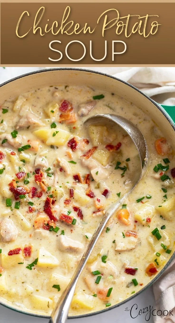 Bowl of delicious chicken potato soup with fresh herbs and vegetables.