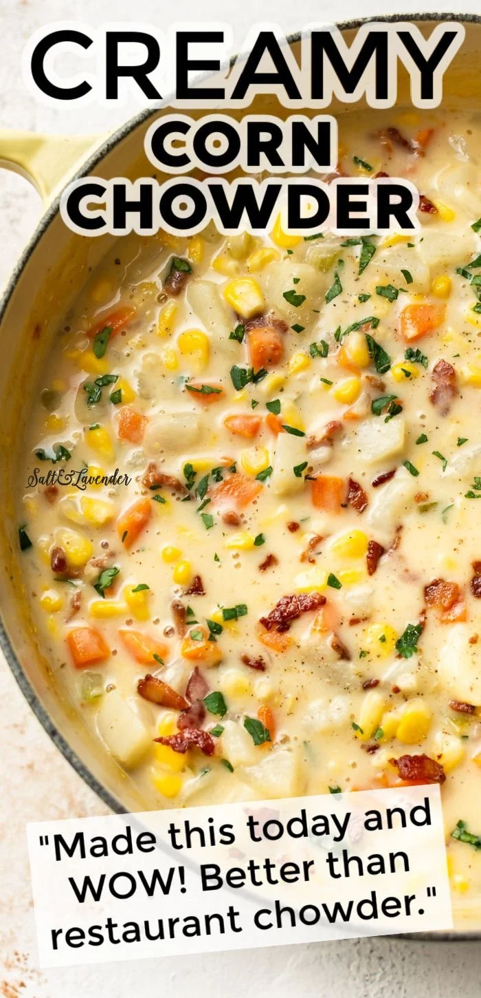 Bowl of creamy corn chowder topped with herbs and served with bread