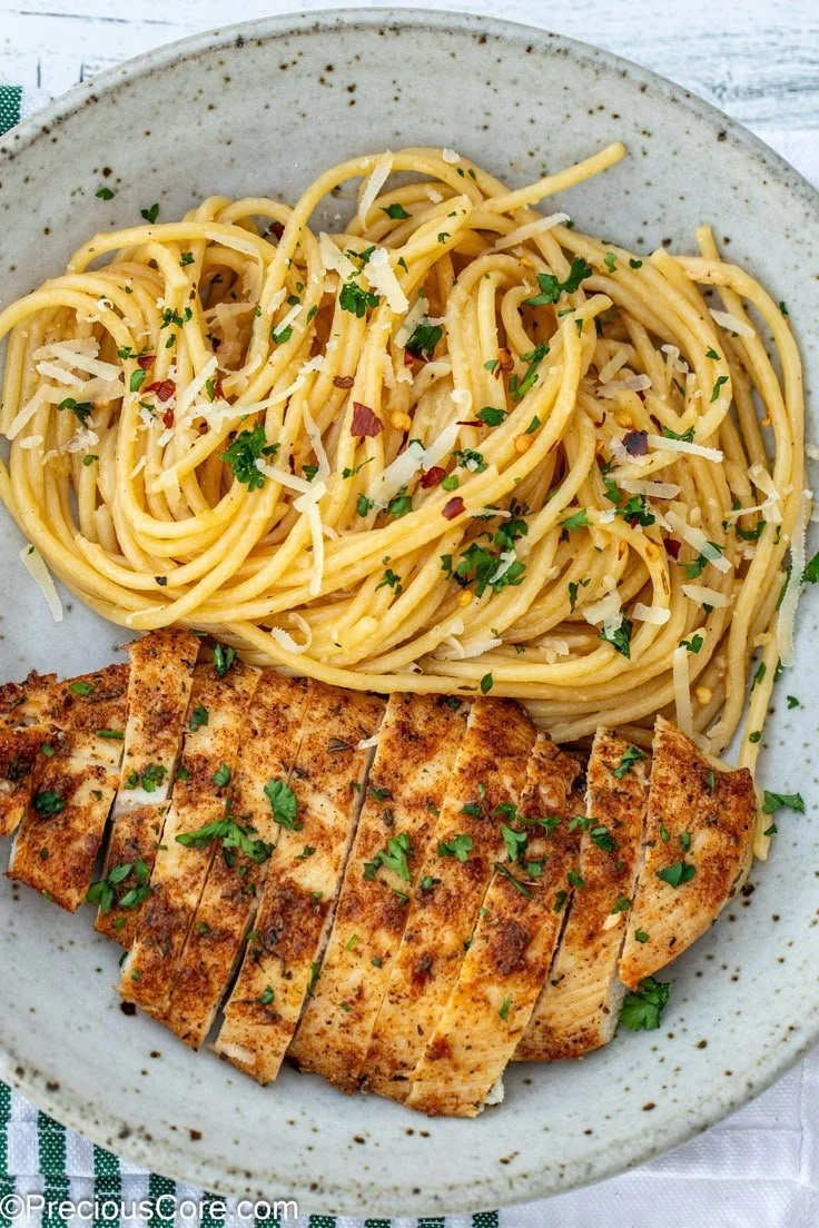 Delicious Garlic Butter Chicken Pasta served in a bowl with herbs