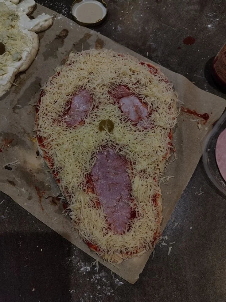 Delicious Ghostface Pizza served with a spooky theme