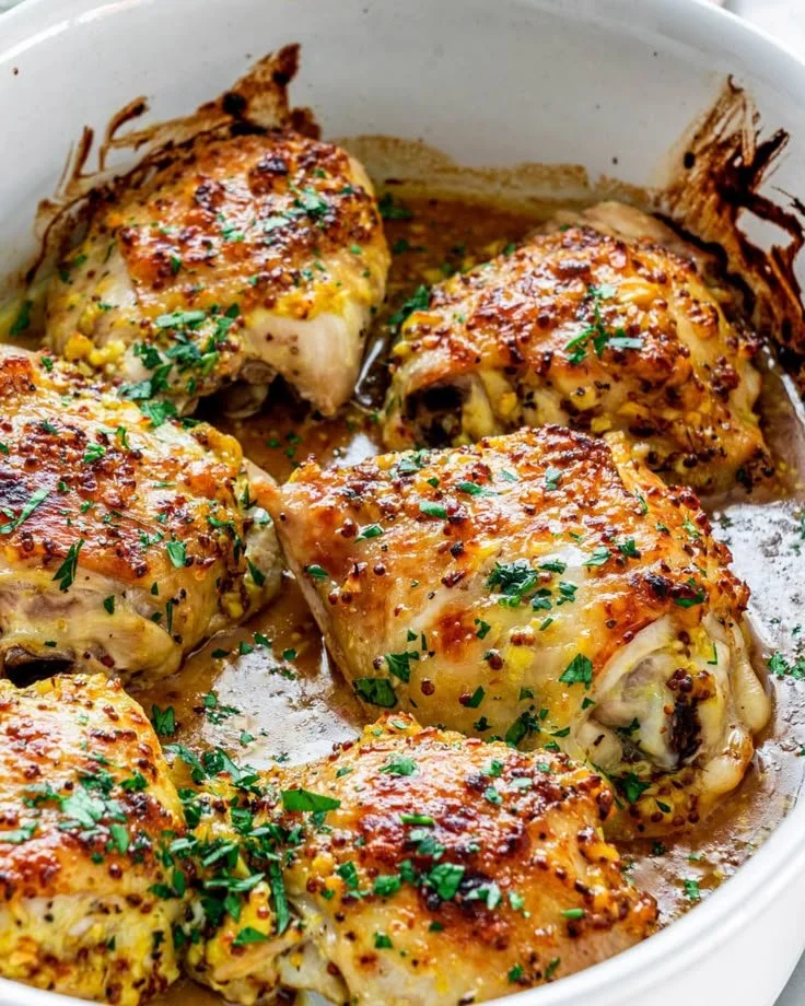 Delicious oven baked chicken thighs served in a savory sauce