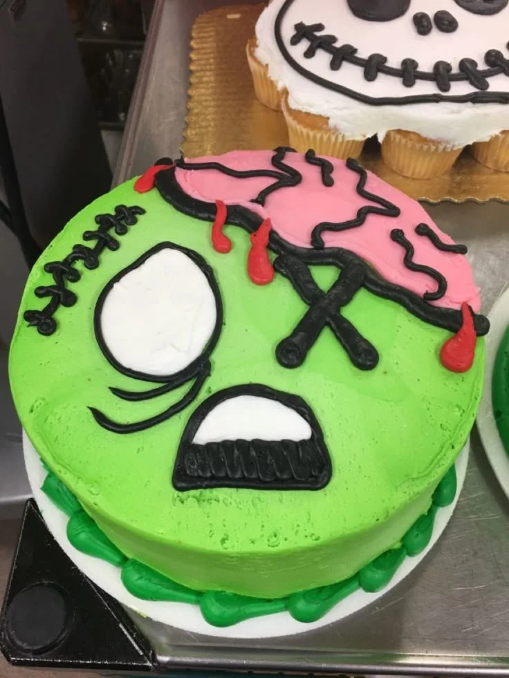 Deliciously spooky Halloween cake decorated with creepy designs and festive colors.