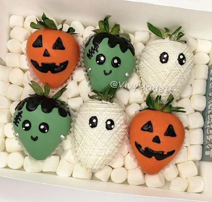 Delicious Halloween chocolate covered strawberries decorated for spooky festivities