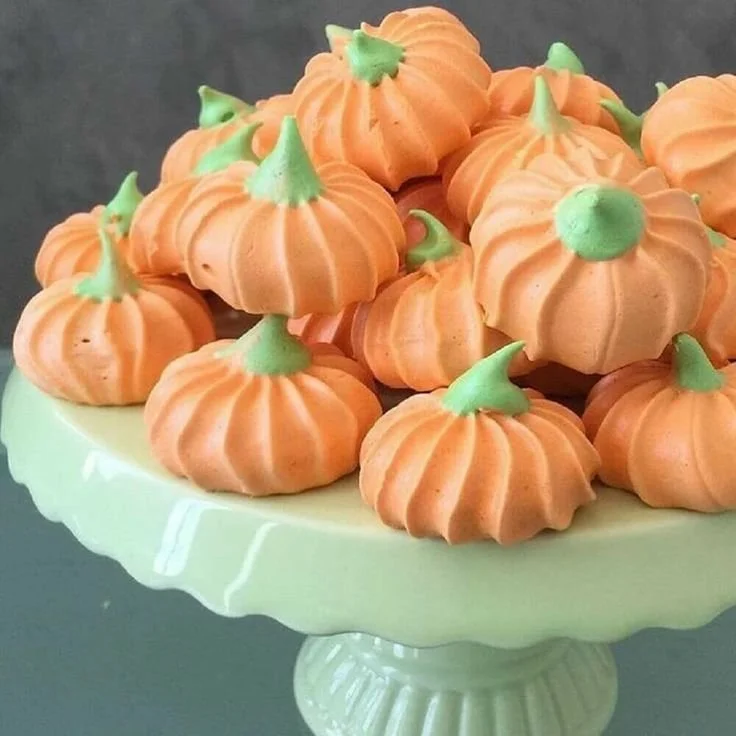 Deliciously decorated pumpkin shaped cookies for autumn treats