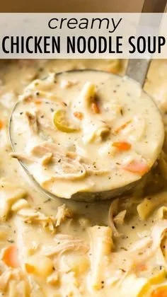 Lightened-up creamy chicken noodle soup in a bowl, garnished with herbs.