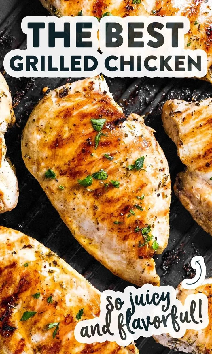 Juicy grilled chicken breast plated with herbs and spices