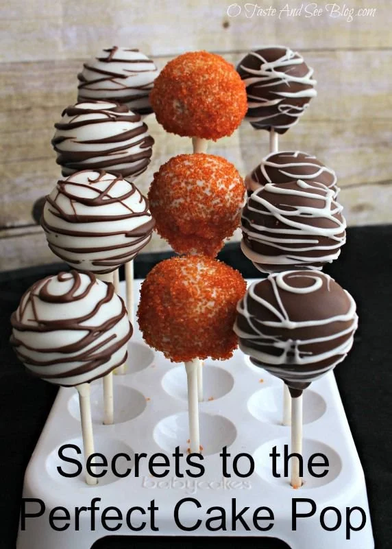 Colorful cake pops on a white plate showcasing expert techniques and creative designs.