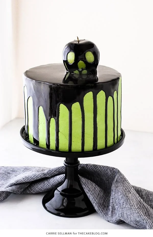 Poison Apple Cake decorated for Halloween with green apples and spooky accents.