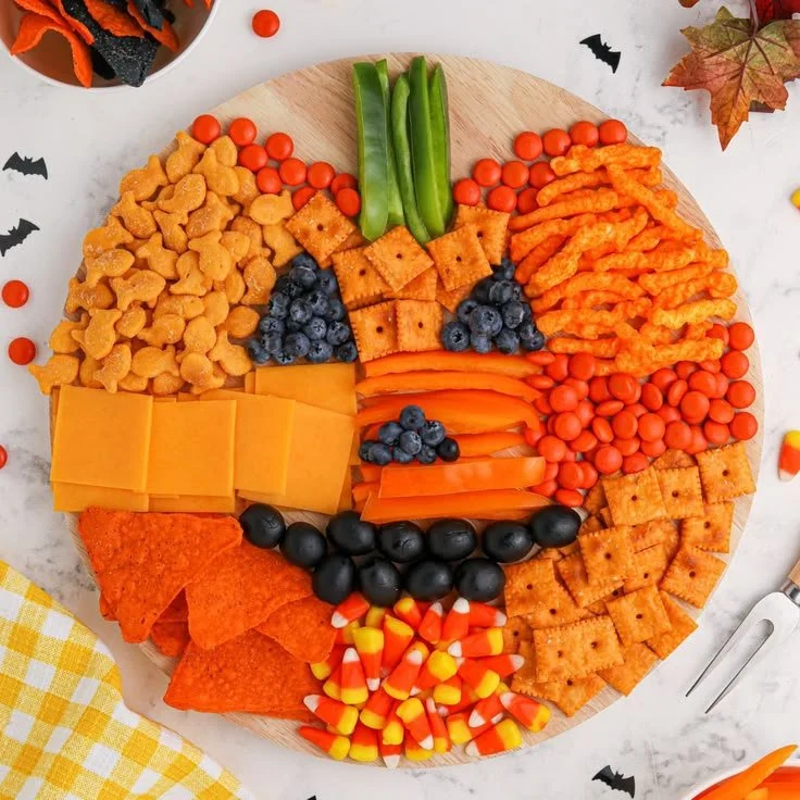 Beautifully arranged pumpkin charcuterie board for Halloween celebration