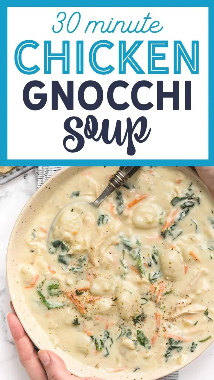 Bowl of homestyle rotisserie chicken gnocchi soup garnished with herbs.