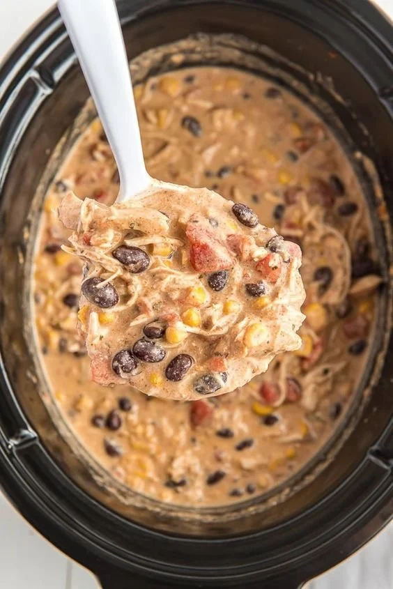 Slow Cooker Tex Mex Shredded Chicken served in a bowl with toppings