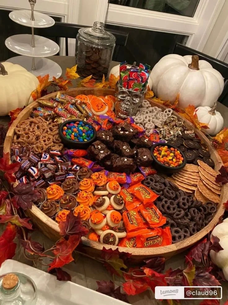 Spooky Halloween candy tray with assorted treats for Halloween party snacks