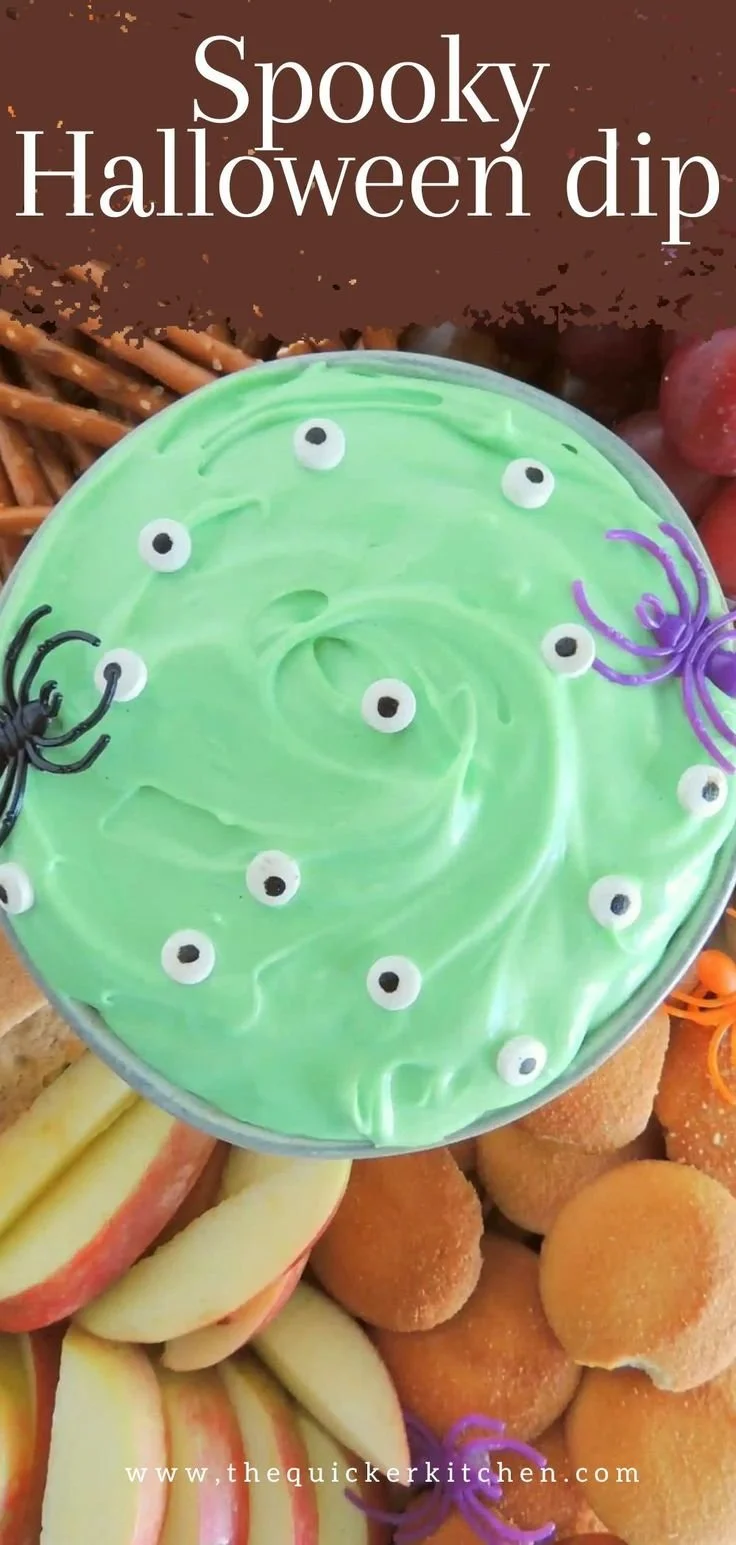 Delicious Spooky Halloween Dip served in a pumpkin bowl with crackers