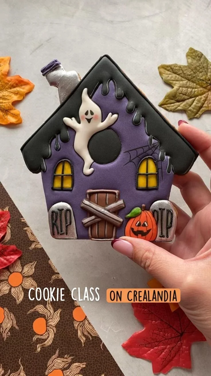 Spooky house Halloween sugar cookies decorated for festive fall treats.