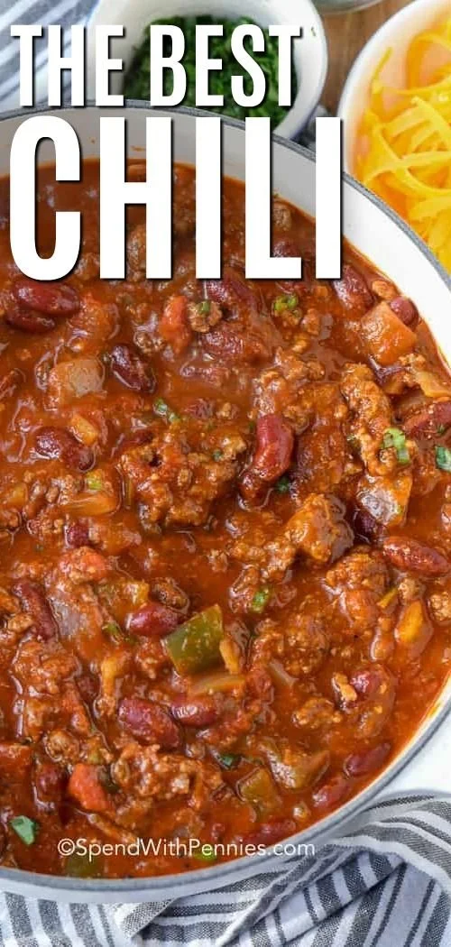 Delicious bowl of the best chili recipe topped with fresh herbs and cheese